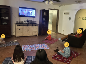 Children enjoying movie night at AJ's Cottage at Sunny Glen Children's Home, a children's home near me