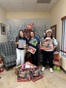 Jubilee Harlingen Cheer team delivering toy donations as part of local volunteering opportunities supporting children at Sunny Glen