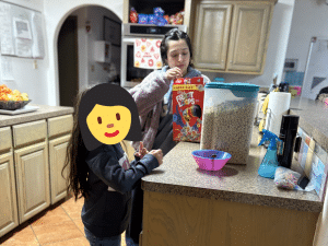 Community service ideas come to life as a caregiver helps a child during a quiet morning routine at Sunny Glen Children’s Home