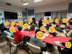 Children and volunteers gathered around tables during a festive Christmas activity night at Sunny Glen, a children’s home in Texas, sharing games, conversation, and community in a welcoming space.
