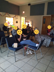 Children and caregivers gathered during a shared evening activity.