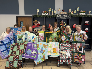Featured in this Sunny Glen Donor Spotlight are these quilters from Southern Comfort RV Resort holding handmade quilts for the children of Sunny Glen Children’s Home.