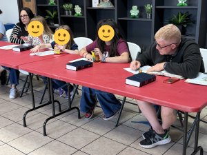 Volunteers from Yellow House ministry at Stephen F. Austin University lead a Bible study with children at Sunny Glen Children's Home during their spring break service trip, representing the idea of helping children in the Rio Grande Valley