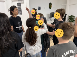 Group of children in care listening to a guide during a SpaceX visit.