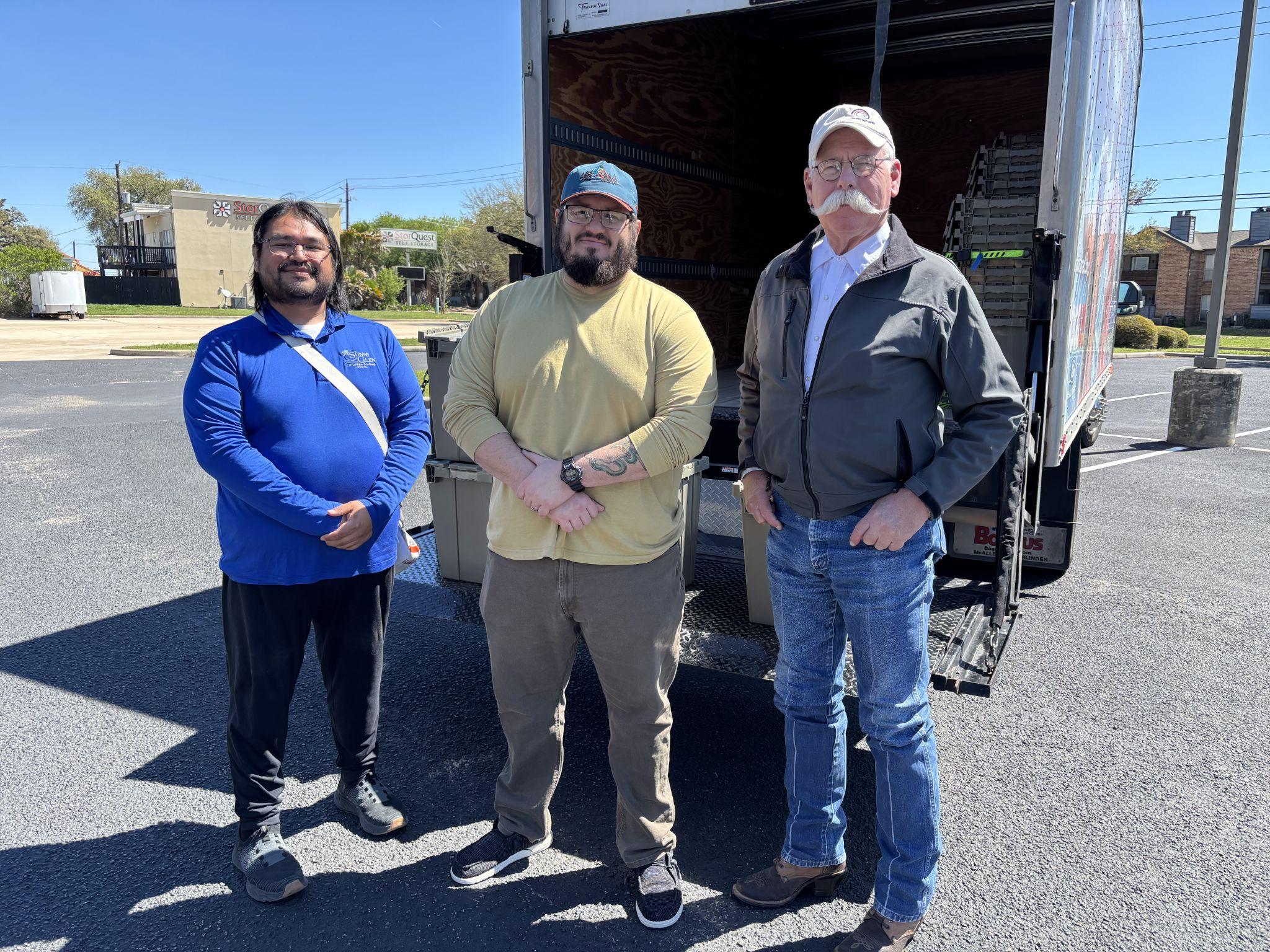 Sunny Glen Campus Minister Mr. Scott Pinkerton (rightmost) stands next to members of Southeast Church of Christ, which joined the Sunny Glen Truck Route