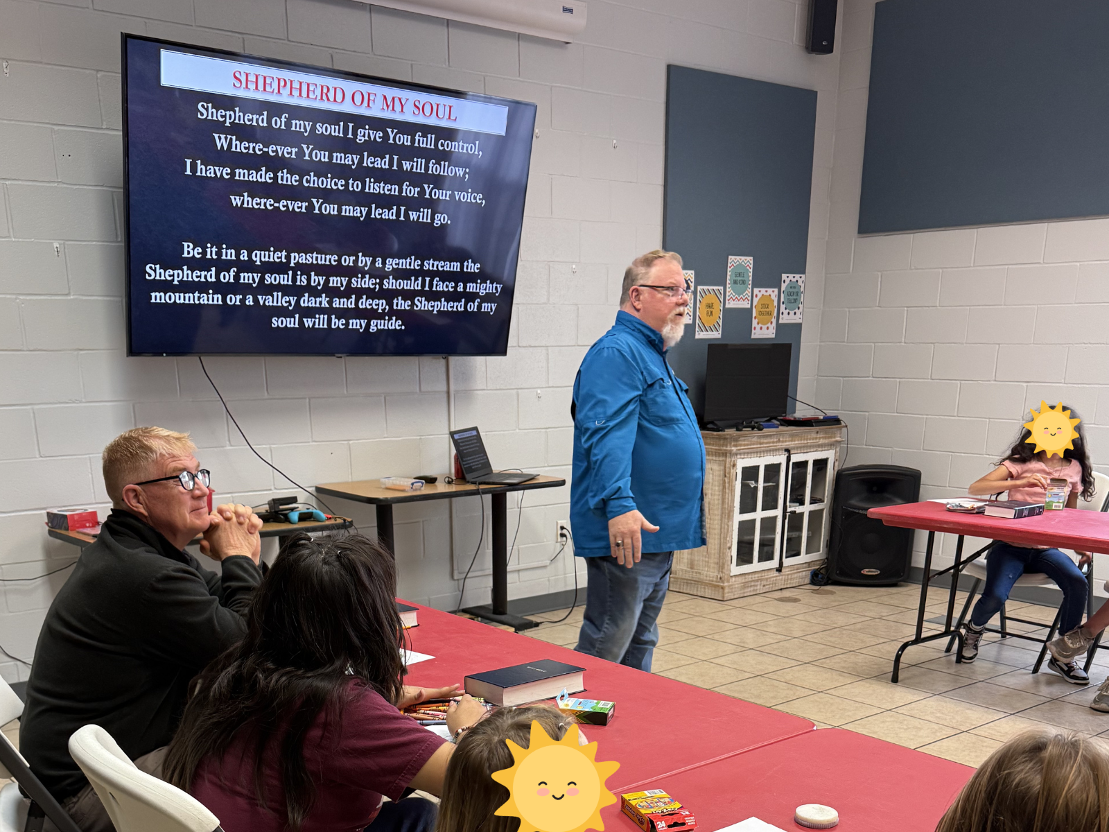 Bible study with the children of Sunny Glen, led by Sunny Glen Campus Minister Mr. Rory Craig Keel (in blue) and volunteers from Yellowhouse